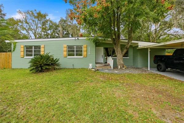 front view of a house with a yard