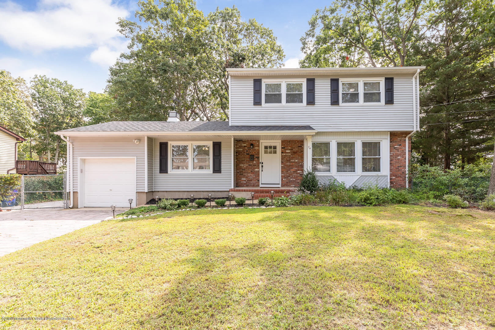 74 Pineland Road Brick, NJ 08724 - Photo 1 of 38 a front view of a house with a yard
