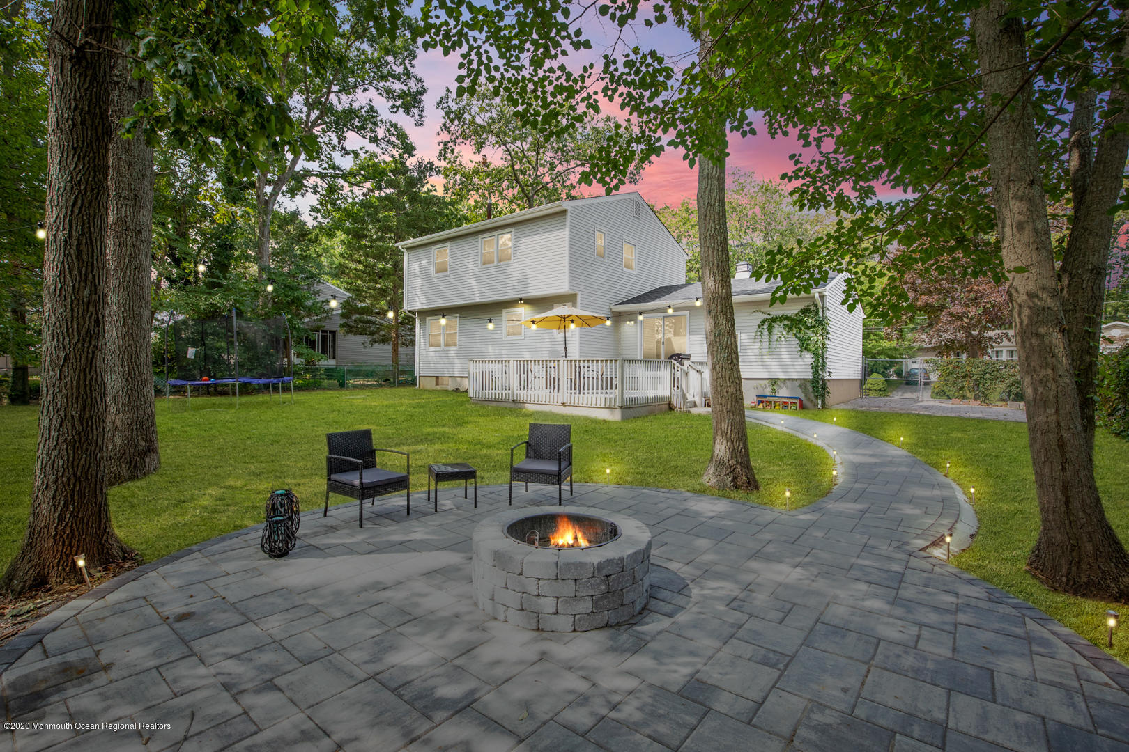 74 Pineland Road Brick, NJ 08724 - Photo 2 of 38 a view of a garden with a slide and a lake view