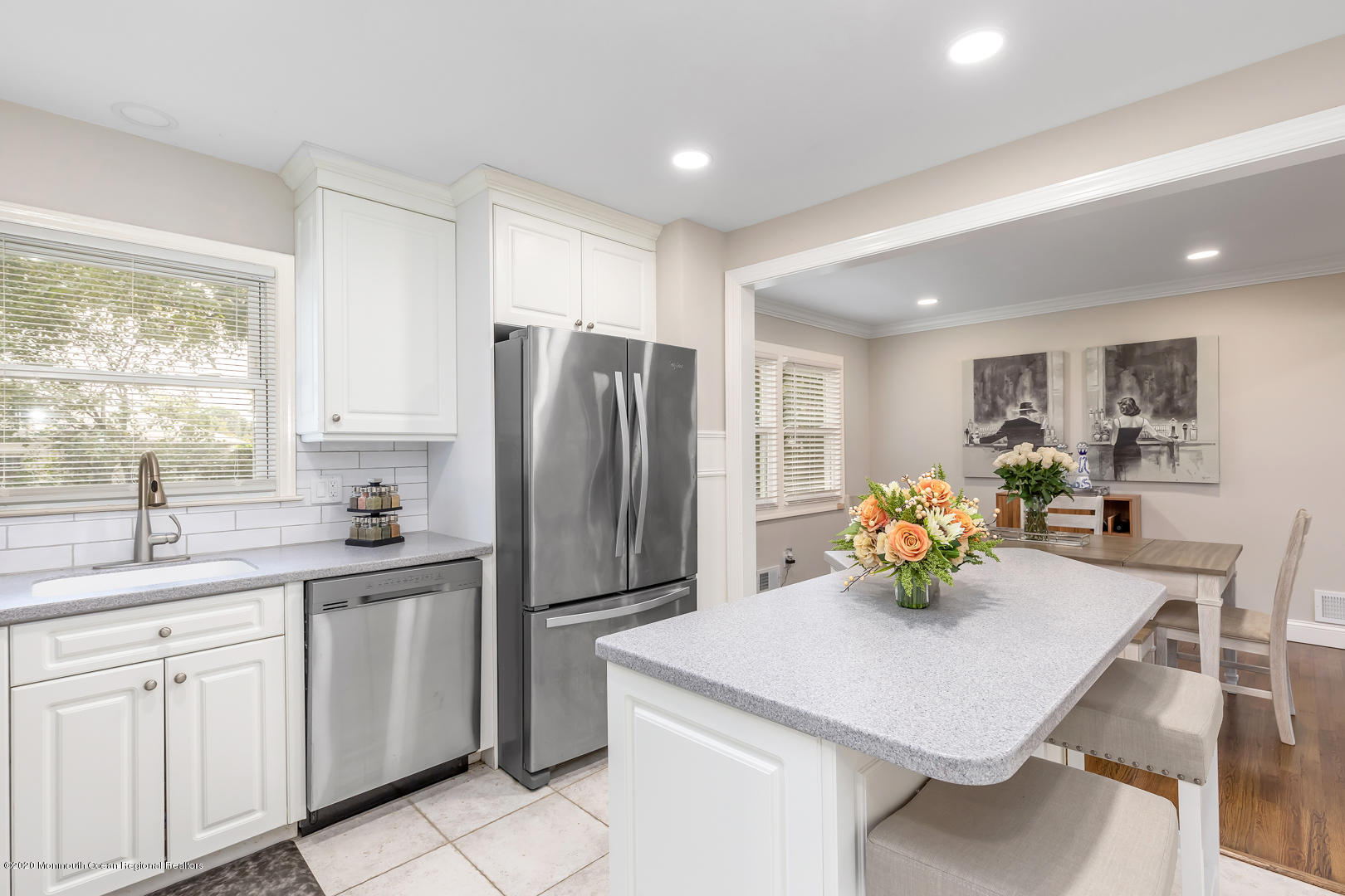 74 Pineland Road Brick, NJ 08724 - Photo 12 of 38 a kitchen with refrigerator and chairs