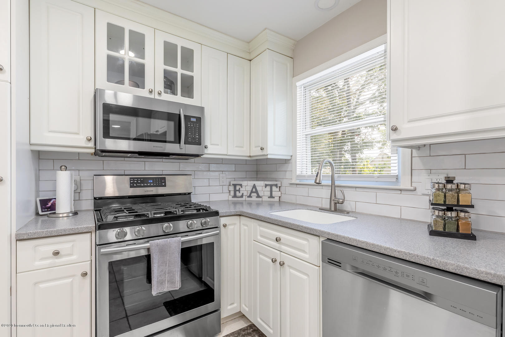 74 Pineland Road Brick, NJ 08724 - Photo 13 of 38 a kitchen with cabinets stainless steel appliances a sink and a window