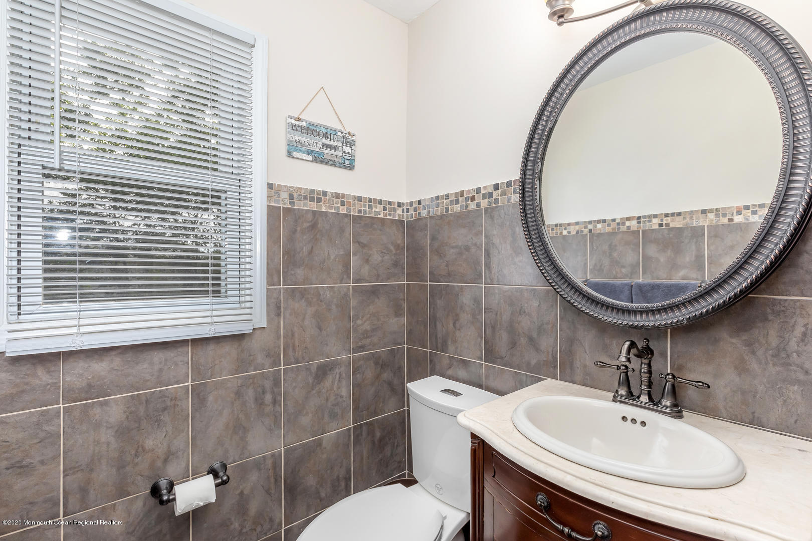 74 Pineland Road Brick, NJ 08724 - Photo 14 of 38 a bathroom with a sink a toilet and a mirror