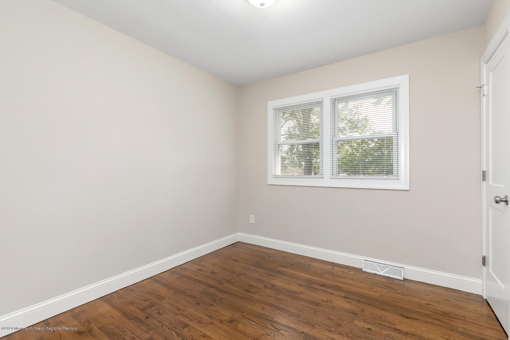 74 Pineland Road Brick, NJ 08724 - Photo 20 of 38 an empty room with wooden floor and windows