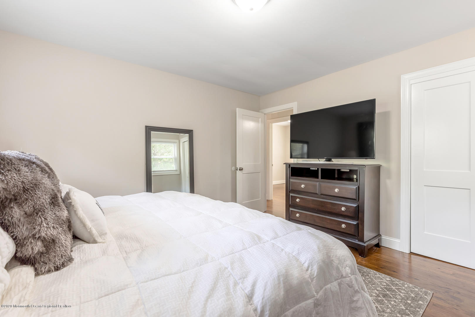 74 Pineland Road Brick, NJ 08724 - Photo 23 of 38 a bedroom with a bed and a flat screen tv