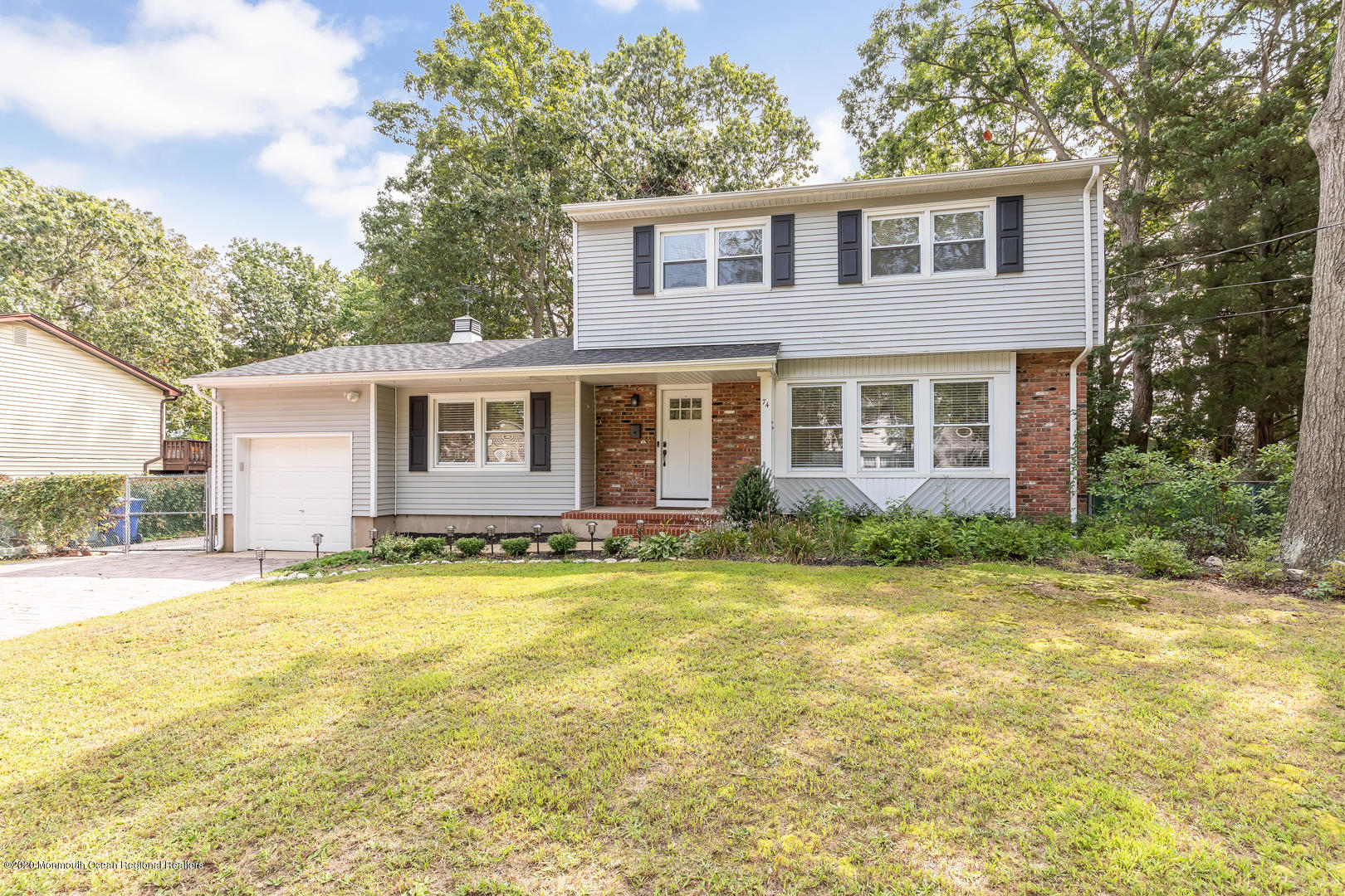 74 Pineland Road Brick, NJ 08724 - Photo 25 of 38 a front view of a house with a yard