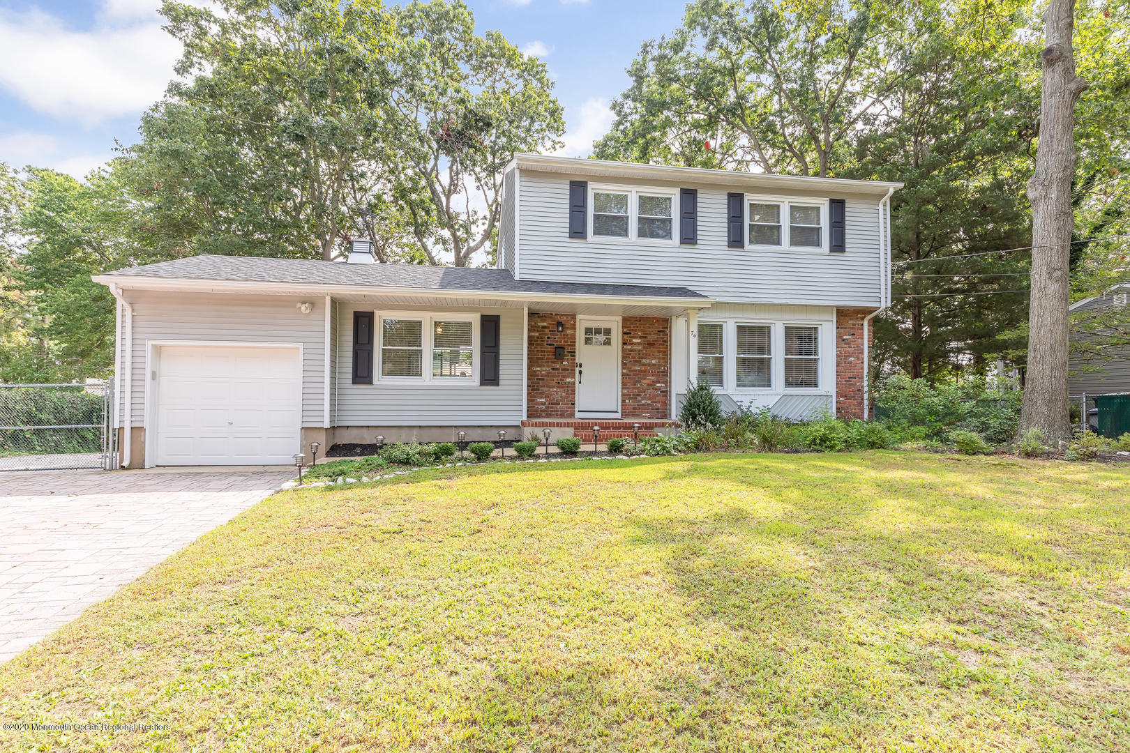 74 Pineland Road Brick, NJ 08724 - Photo 26 of 38 a front view of a house with a yard
