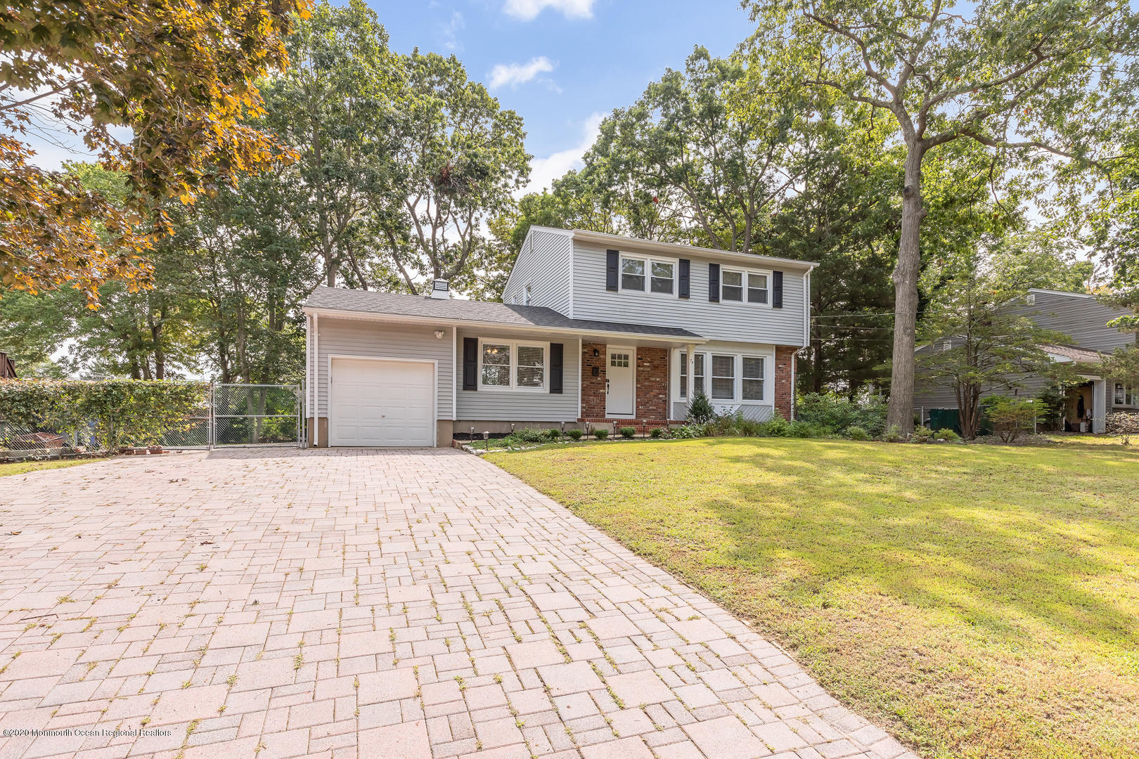 74 Pineland Road Brick, NJ 08724 - Photo 27 of 38 a front view of a house with swimming pool and porch