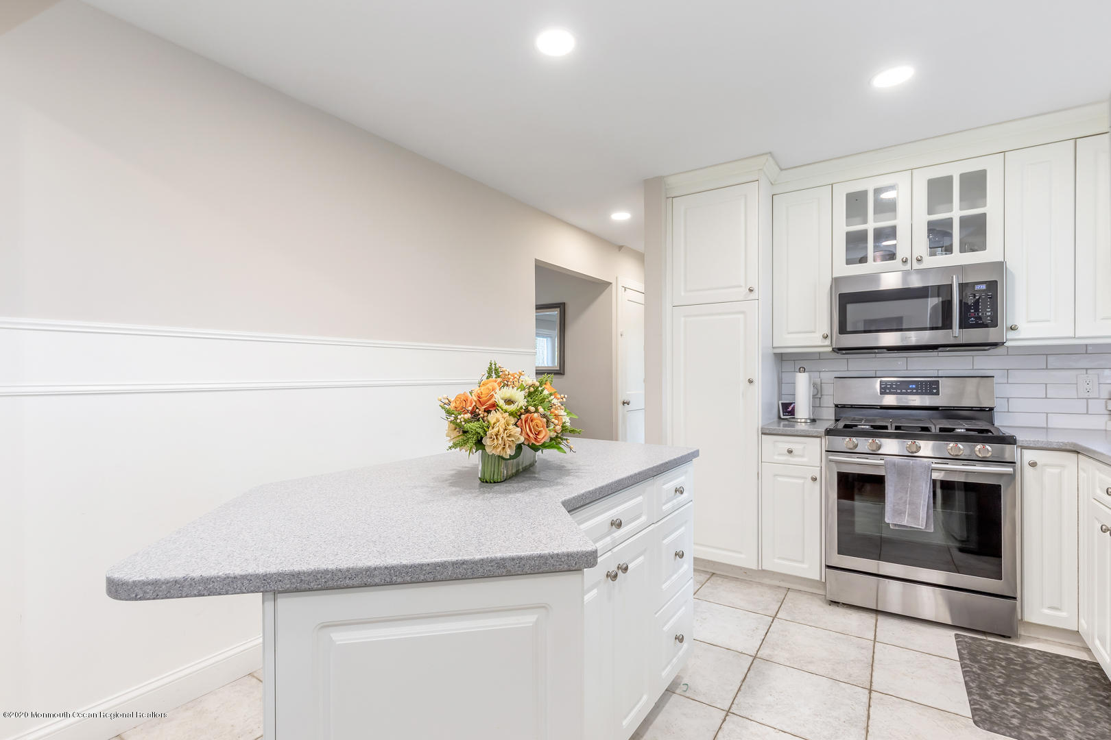 74 Pineland Road Brick, NJ 08724 - Photo 10 of 38 a kitchen with stainless steel appliances a stove microwave and cabinets