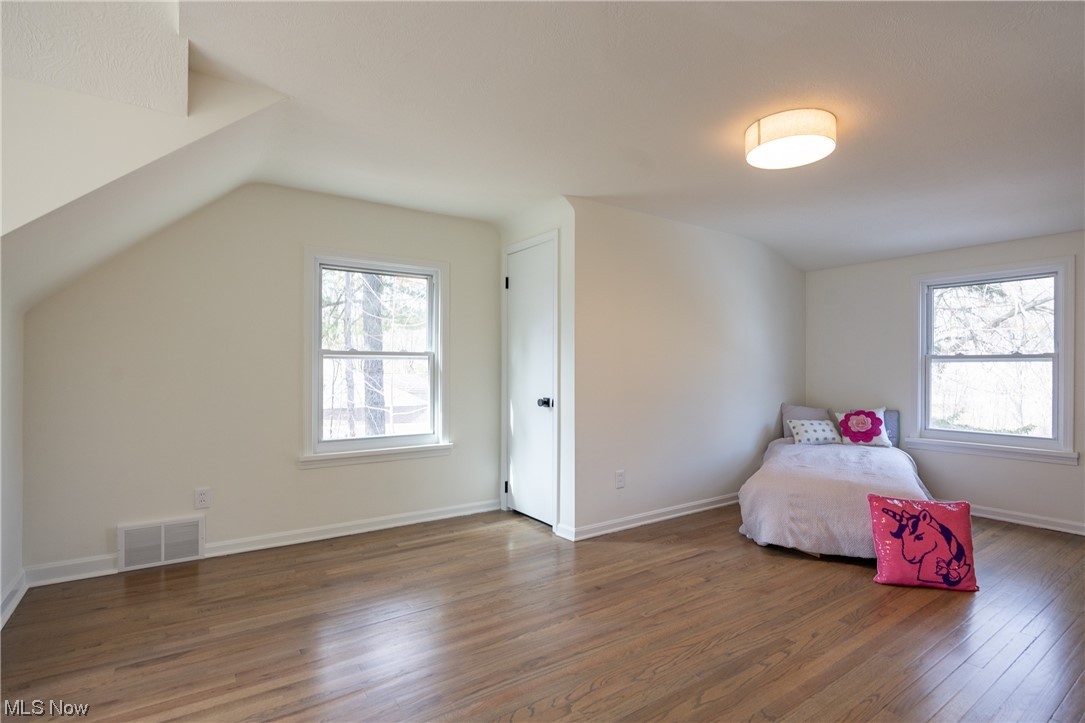 32887 Cedar Road Mayfield Heights, OH 44124 - Photo 24 of 44 Bedroom with lofted ceiling and dark wood-type flooring