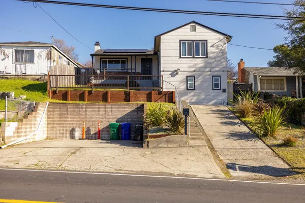 a front view of a house with a yard
