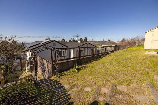a view of a balcony with two chairs