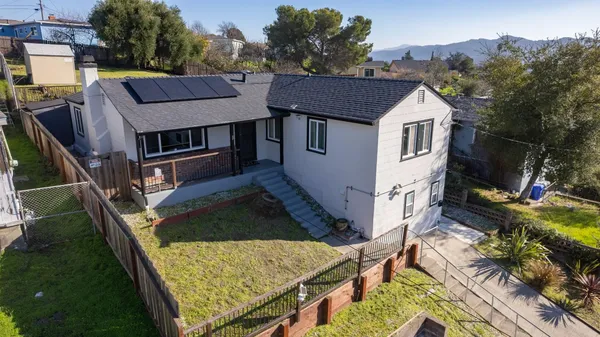 a view of house and yard with green space