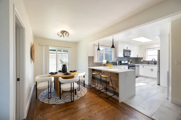 a kitchen with stainless steel appliances kitchen island granite countertop a sink and cabinets