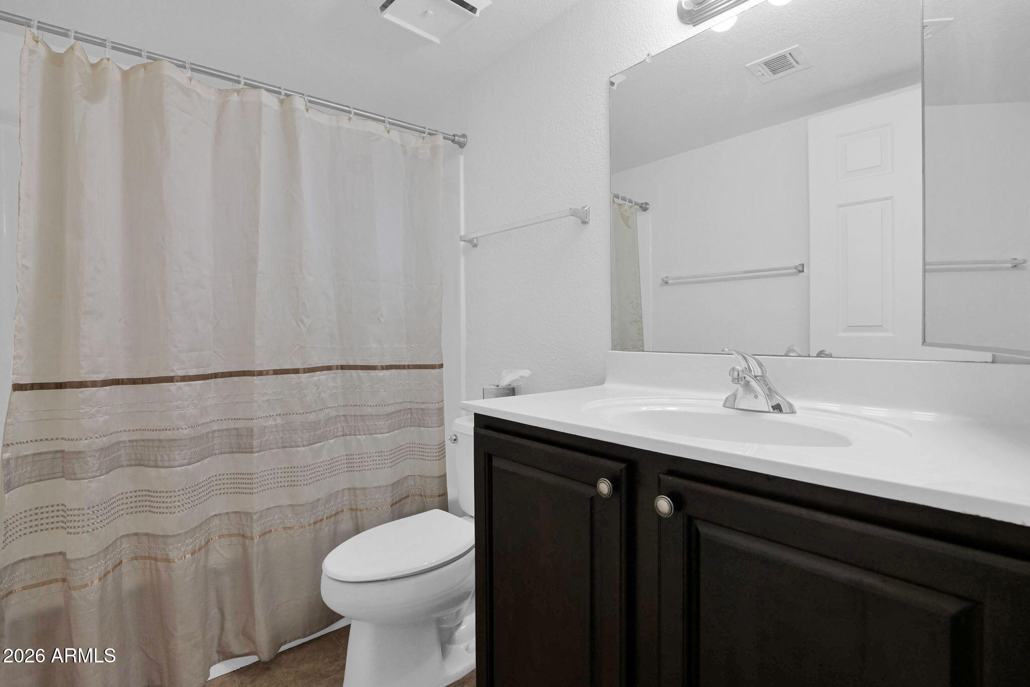 1720 East Thunderbird Road, Unit 1019 Phoenix, AZ 85022 - Photo 7 of 47 a bathroom with a granite countertop sink toilet and a mirror