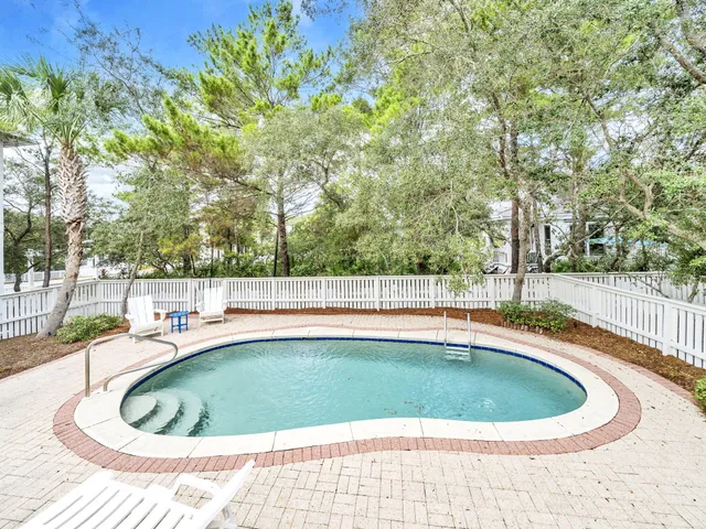 a view of a swimming pool with a patio