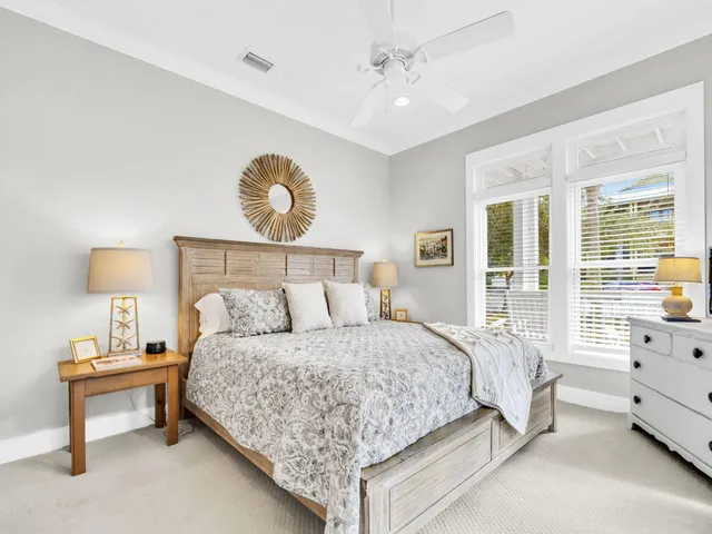 a bedroom with a bed and a table