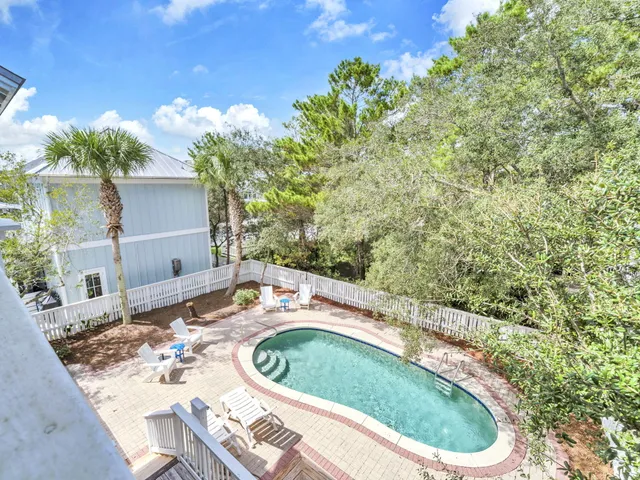 a backyard of a house with outdoor seating