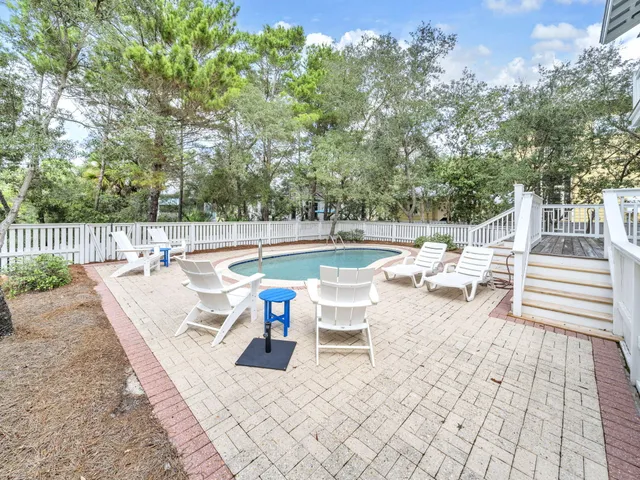 a view of a swimming pool with a lounge chair