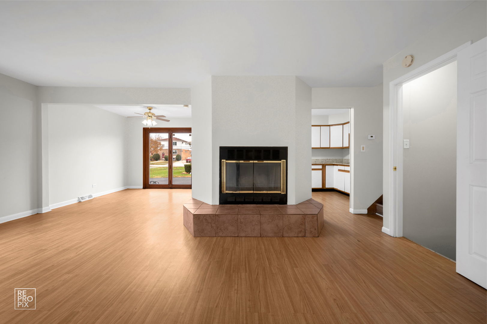 502 East Memorial Road Bensenville, IL 60106 - Photo 4 of 20 a view of a livingroom with wooden floor and a fireplace