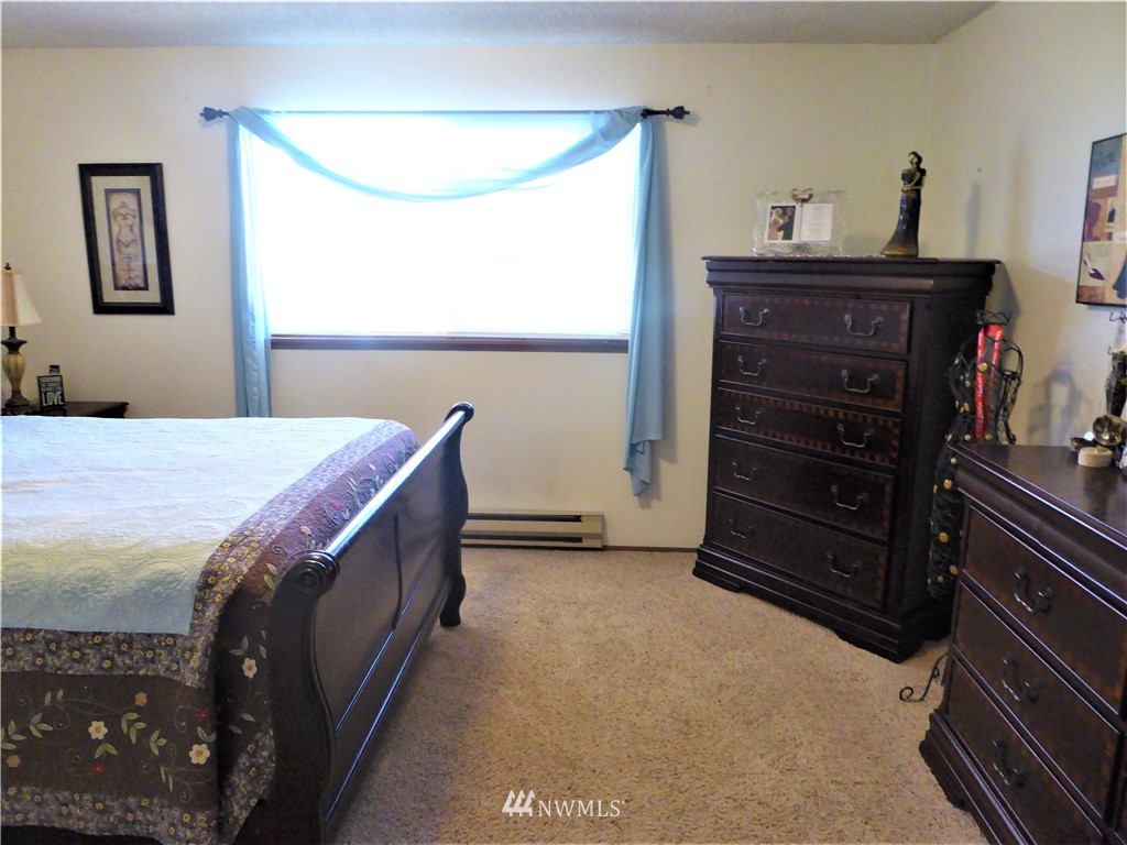 17135 Sargent Road Southwest Rochester, WA 98579 - Photo 20 of 34 a bedroom with a bed and a dresser