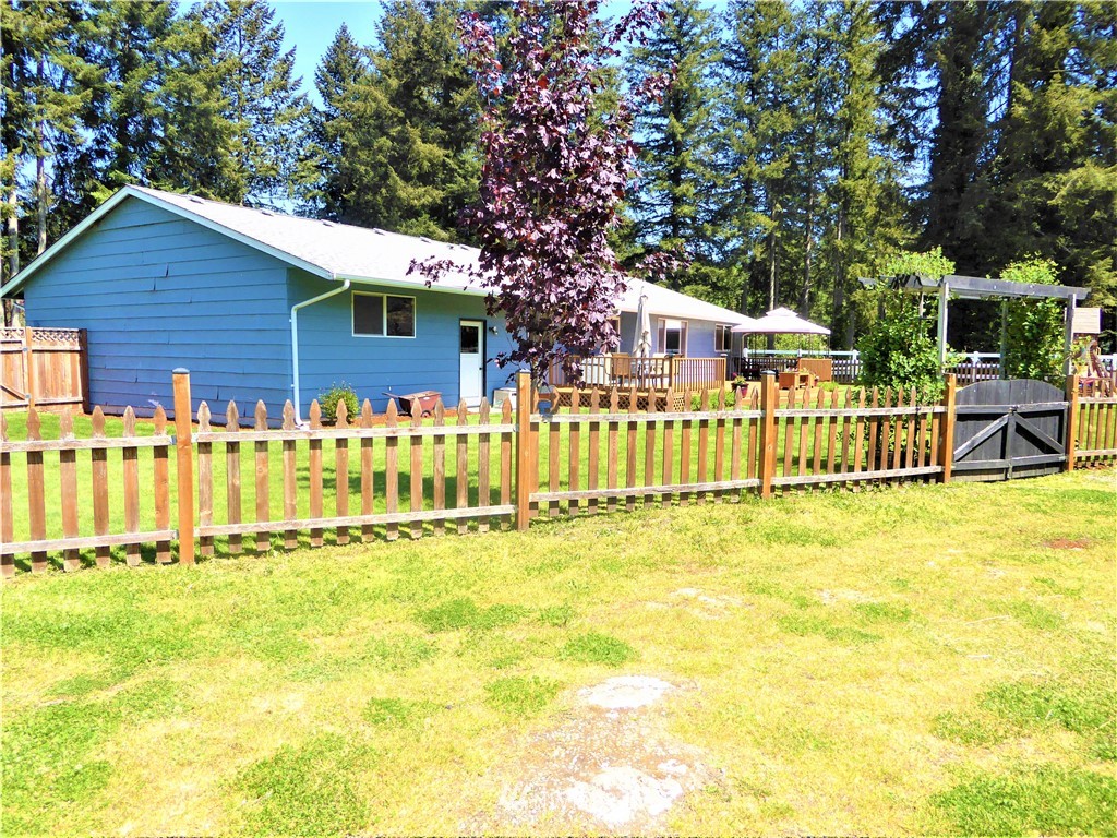 17135 Sargent Road Southwest Rochester, WA 98579 - Photo 3 of 34 a front view of a house with a small yard
