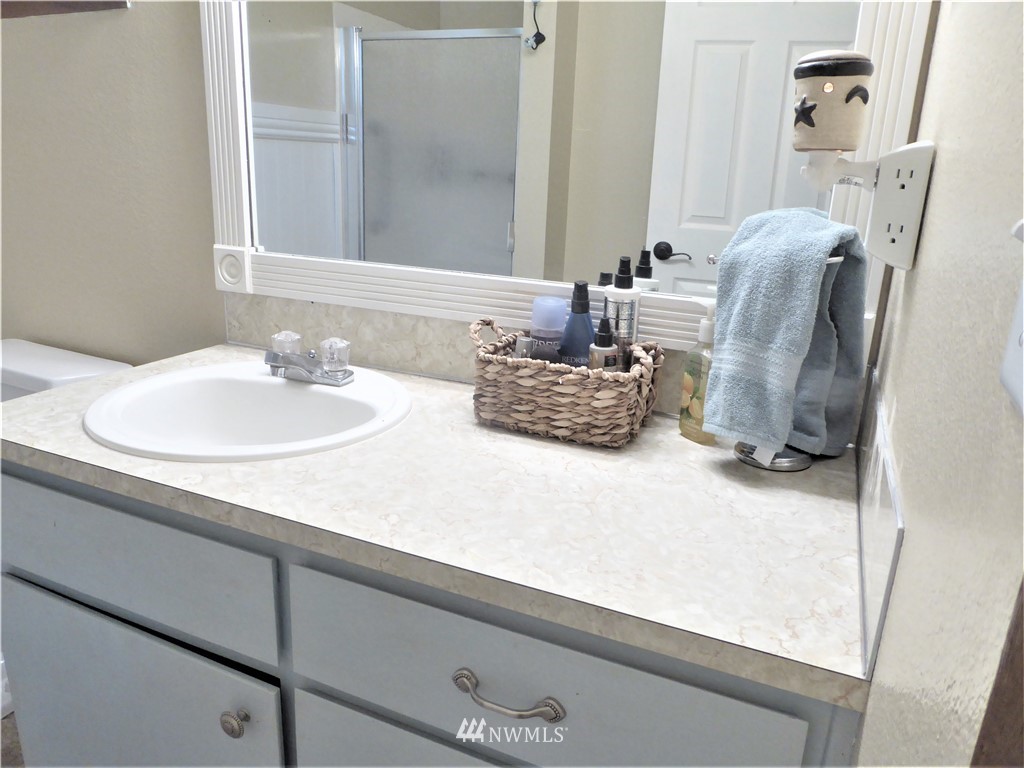 17135 Sargent Road Southwest Rochester, WA 98579 - Photo 22 of 34 a bathroom with a sink and a mirror