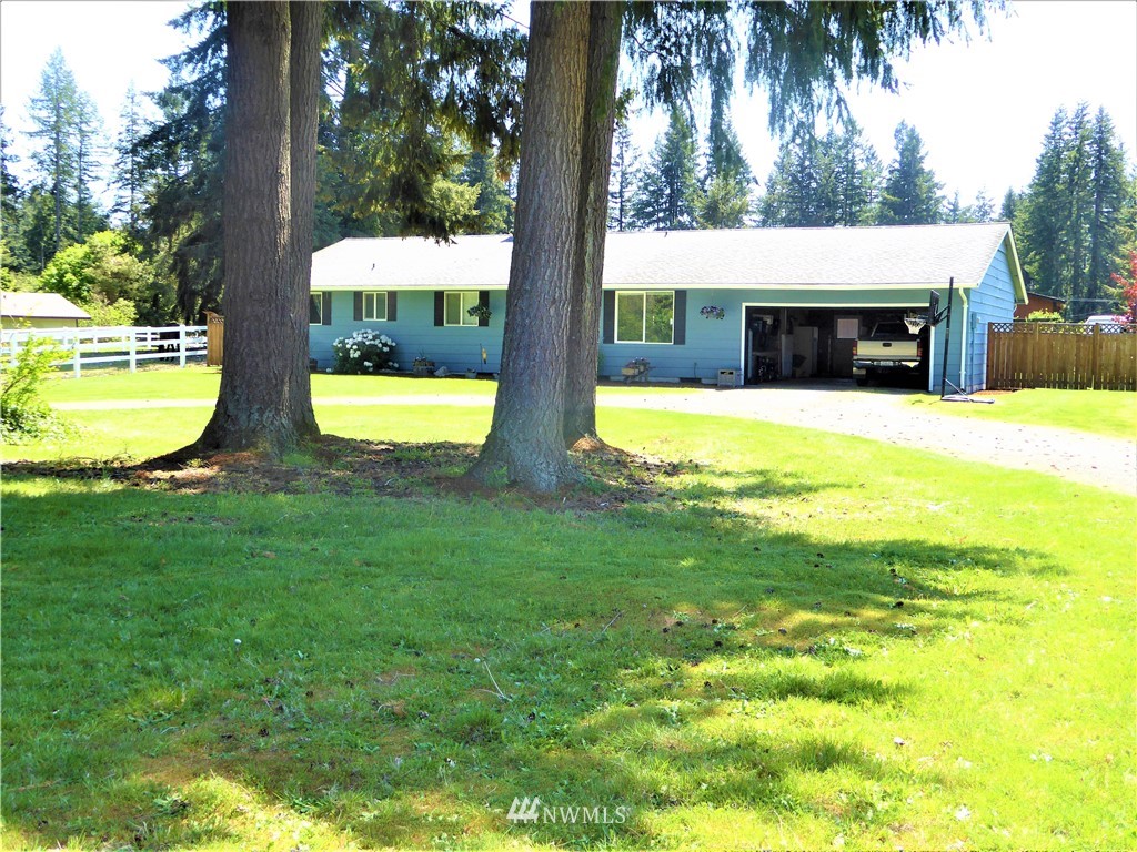 17135 Sargent Road Southwest Rochester, WA 98579 - Photo 31 of 34 a view of a house with swimming pool and a yard
