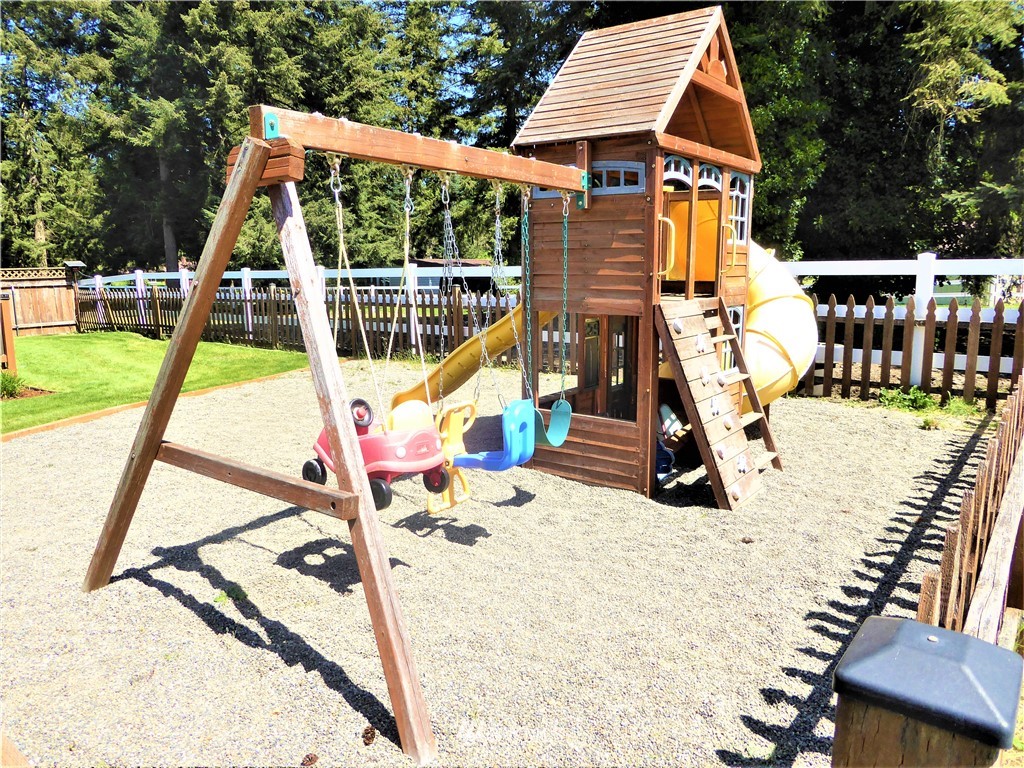 17135 Sargent Road Southwest Rochester, WA 98579 - Photo 33 of 34 a view of a backyard with a small deck