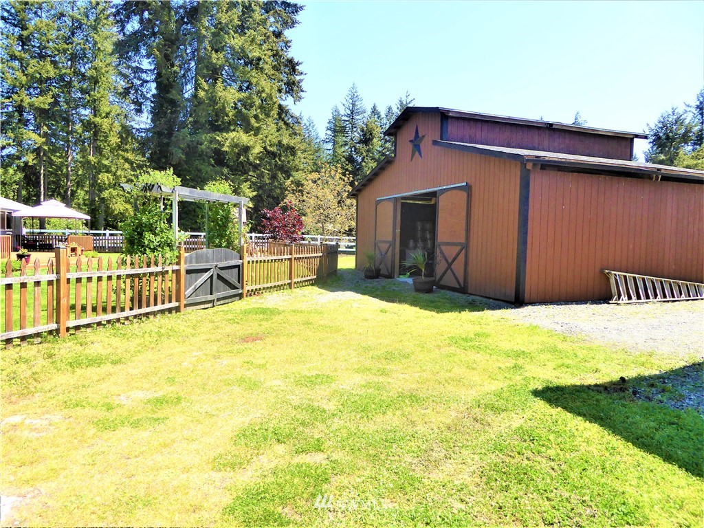 17135 Sargent Road Southwest Rochester, WA 98579 - Photo 5 of 34 a house view with a backyard space