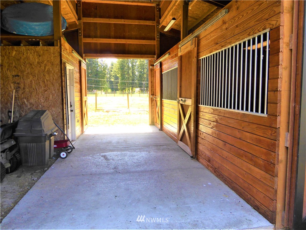 17135 Sargent Road Southwest Rochester, WA 98579 - Photo 6 of 34 a view of a porch with wooden floor and furniture