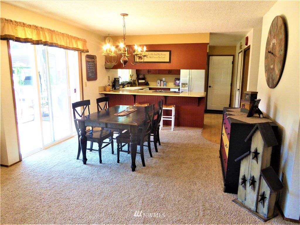 17135 Sargent Road Southwest Rochester, WA 98579 - Photo 10 of 34 a view of a dining room with furniture