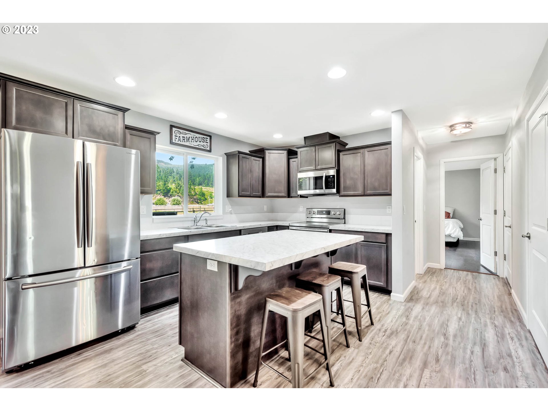 88750 Potter Lane Springfield, OR 97478 - Photo 11 of 43 a kitchen with stainless steel appliances a refrigerator and a stove top oven