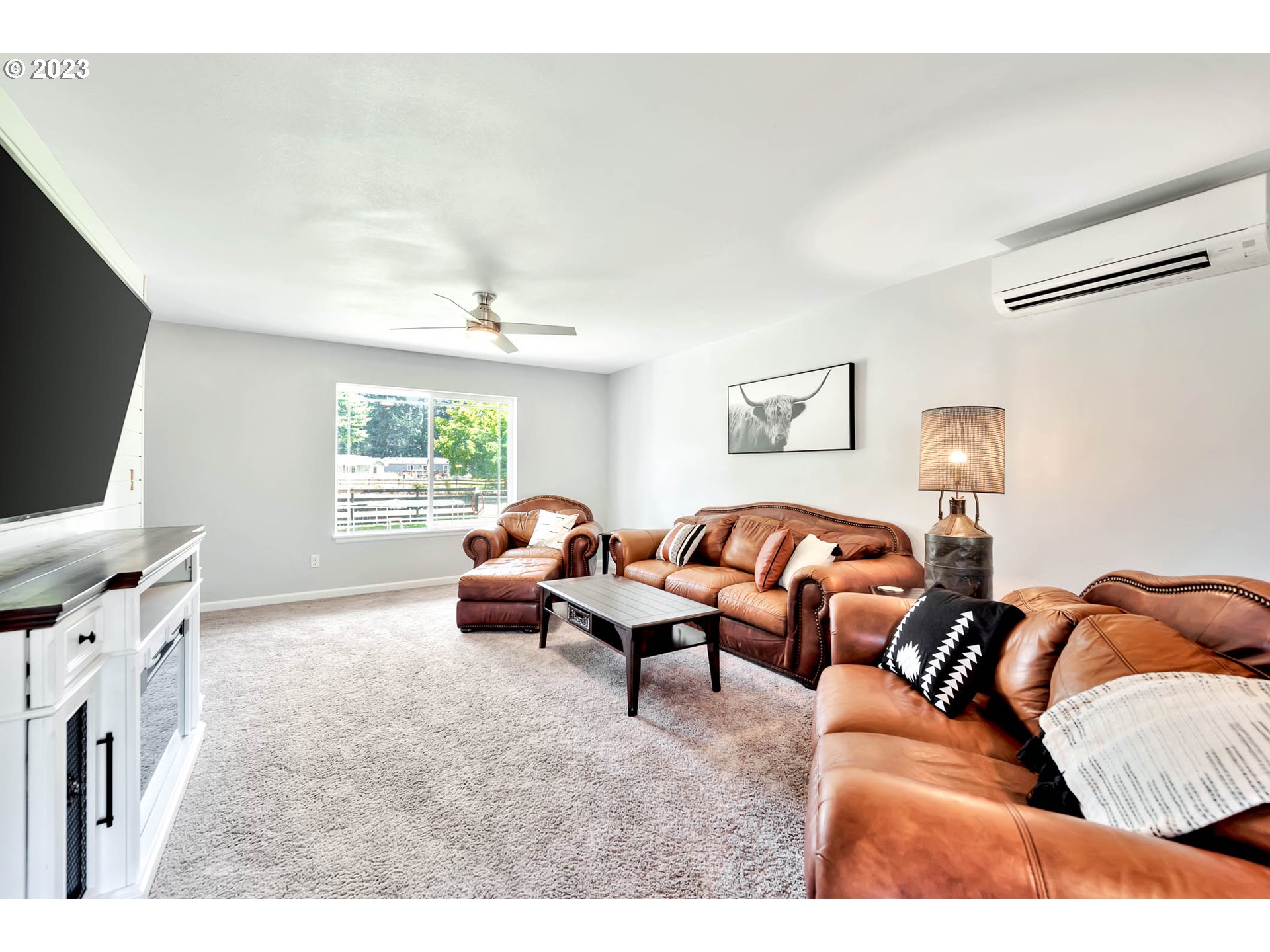 88750 Potter Lane Springfield, OR 97478 - Photo 10 of 43 a living room with furniture and a flat screen tv