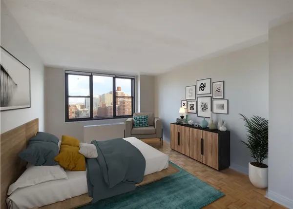 a spacious bedroom with a bed and window