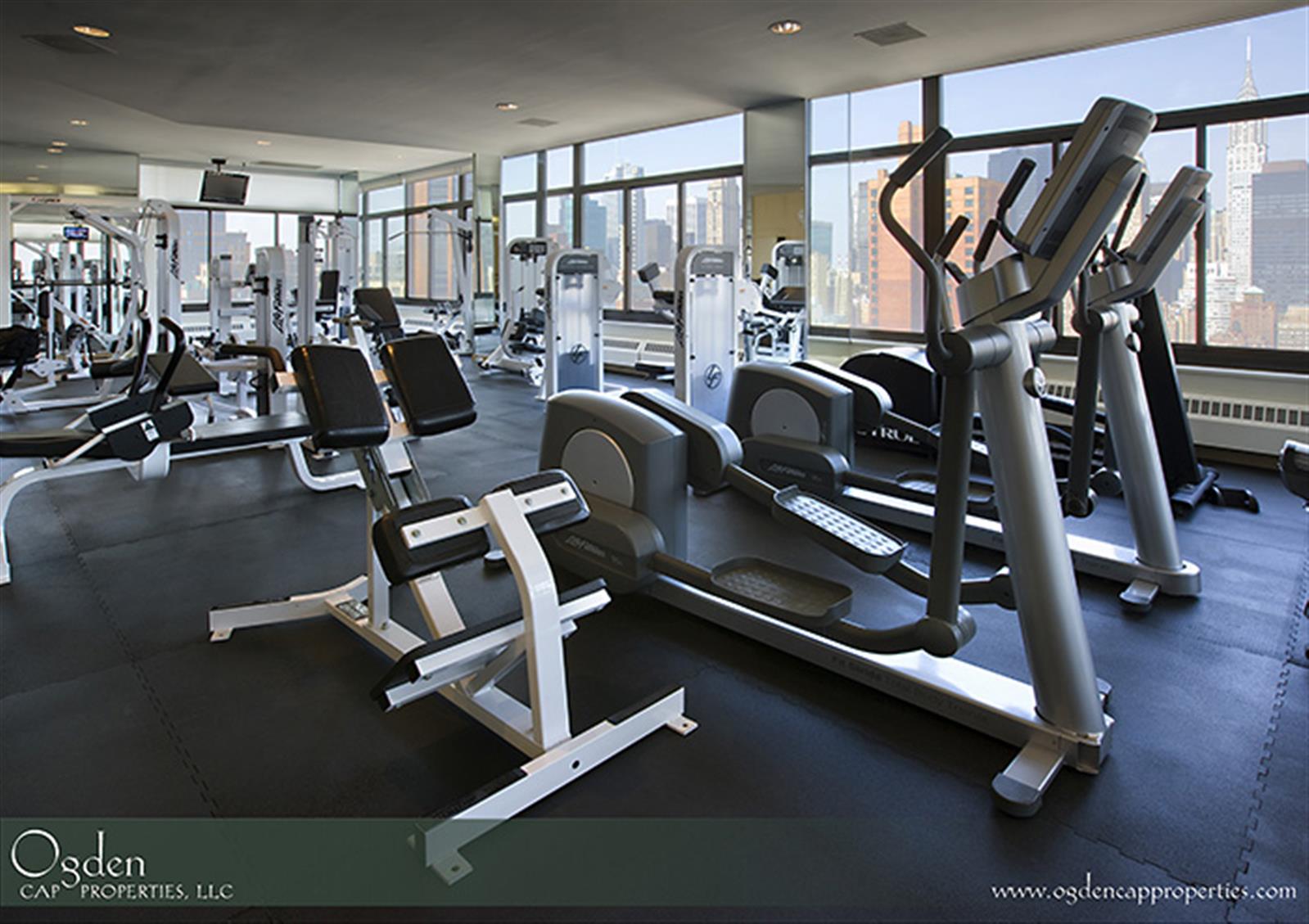 155 East 31st Street, Unit W8F Manhattan, NY 10016 - Photo 8 of 10 a view of a room with gym equipment