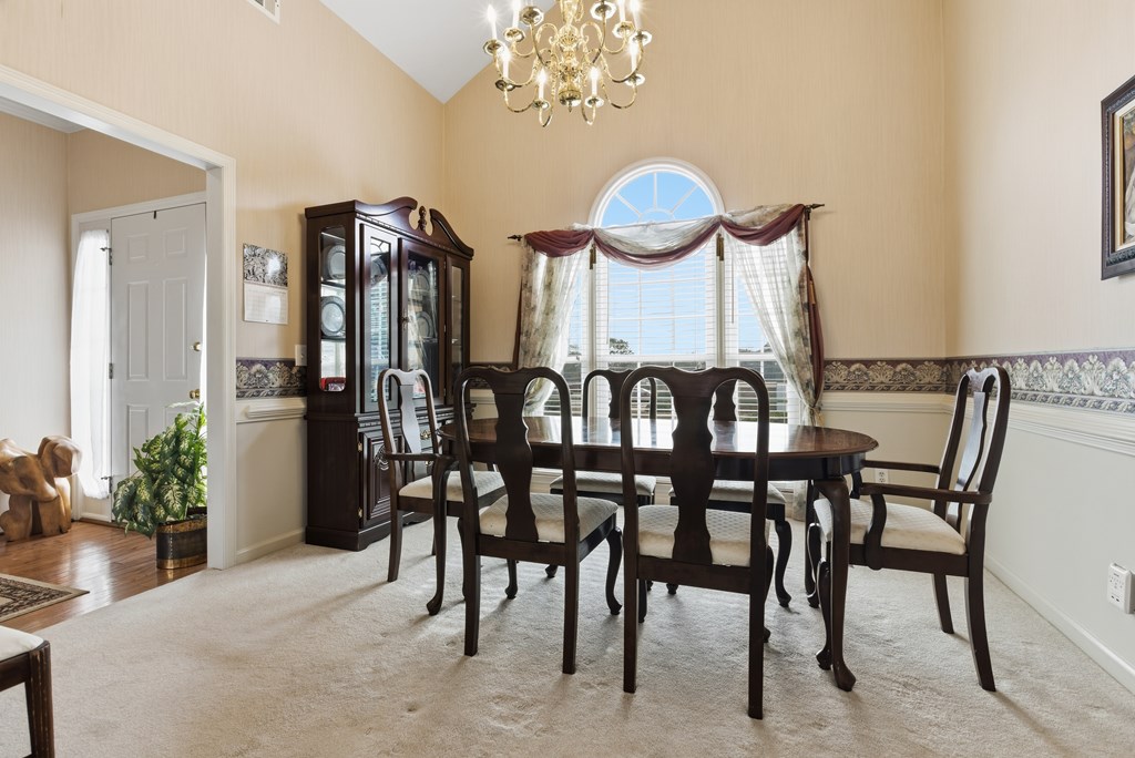4827 Cedar Ridge Drive Columbus, GA 31909 - Photo 11 of 33 a view of a dining room with furniture and wooden floor