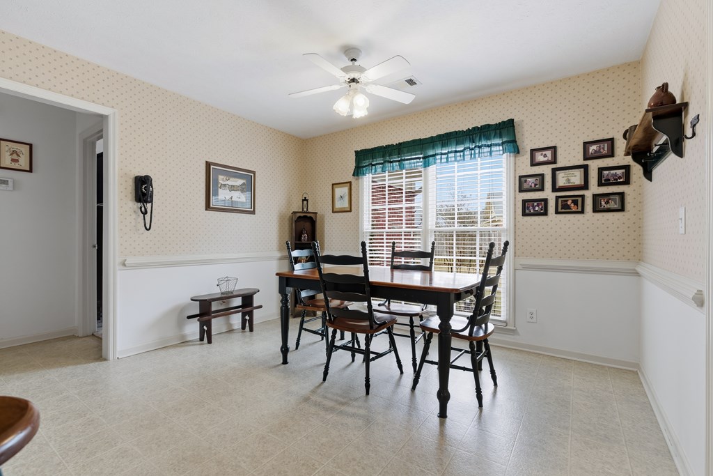 4827 Cedar Ridge Drive Columbus, GA 31909 - Photo 16 of 33 a view of a dining room with furniture and chandelier