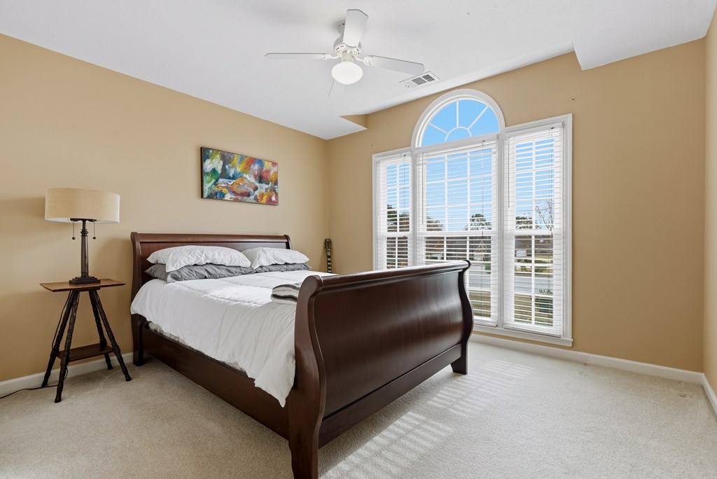 4827 Cedar Ridge Drive Columbus, GA 31909 - Photo 22 of 33 a bedroom with a bed and a window