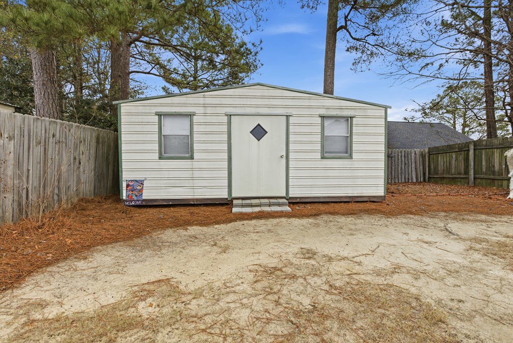 4827 Cedar Ridge Drive Columbus, GA 31909 - Photo 30 of 33 a front view of a house with a yard and garage