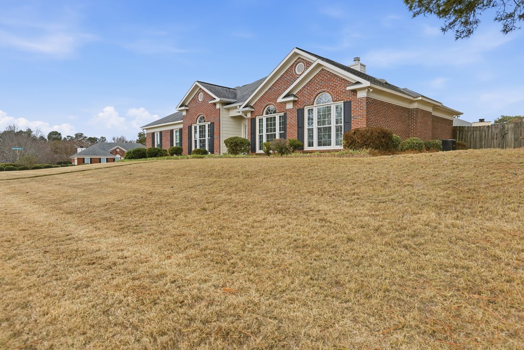 4827 Cedar Ridge Drive Columbus, GA 31909 - Photo 3 of 33 a front view of a house with a yard and garage