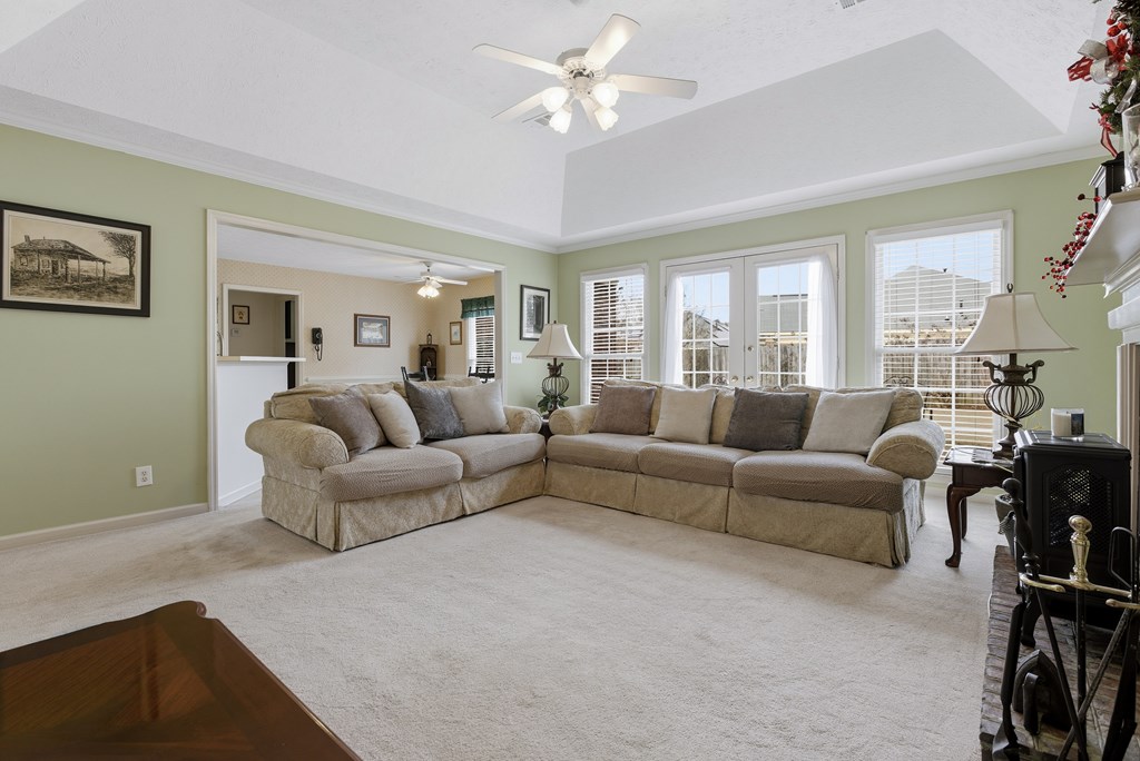 4827 Cedar Ridge Drive Columbus, GA 31909 - Photo 8 of 33 a living room with furniture a ceiling fan and a window