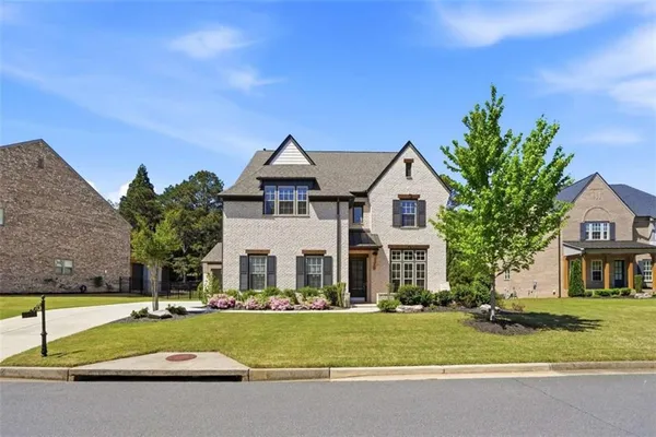 a front view of a house with a yard