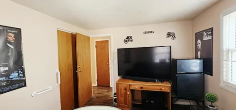 a room with furniture and flat screen tv