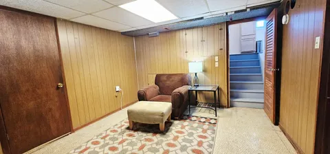 a living room with furniture and a rug