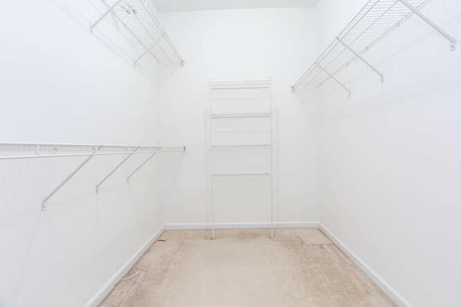 3402 Raes Creek Road, Unit 27 Marietta, GA 30008 - Photo 21 of 32 a view of a room with racks on the wall