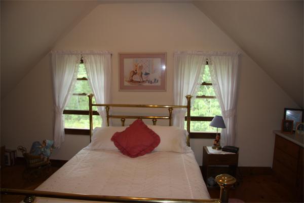 289 Hurricane Hill Road Mason, NH 03048 - Photo 20 of 30 a bedroom with a bed and a window