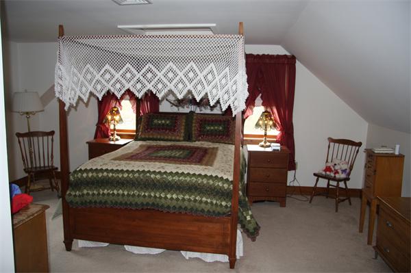 289 Hurricane Hill Road Mason, NH 03048 - Photo 22 of 30 a bedroom with a bed and a mirror on the dresser