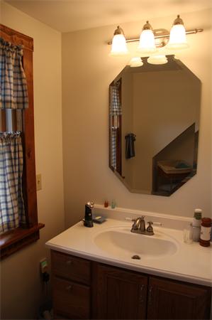 289 Hurricane Hill Road Mason, NH 03048 - Photo 24 of 30 a bathroom with a sink and a mirror