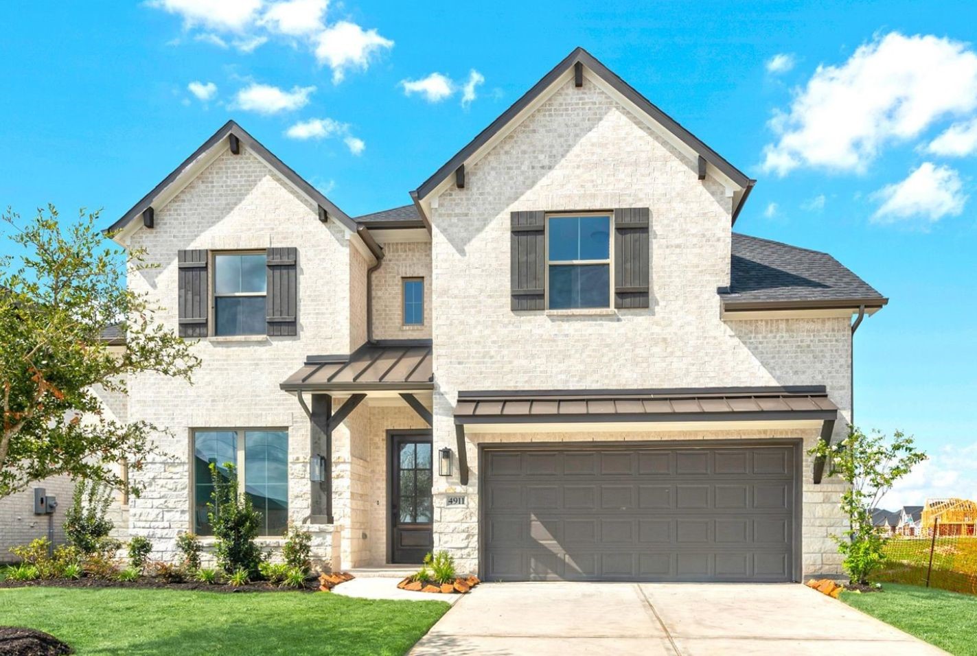 Move in Ready. Westin Homes *New Construction* Preston IX Plan. Grass is digitally enhanced.