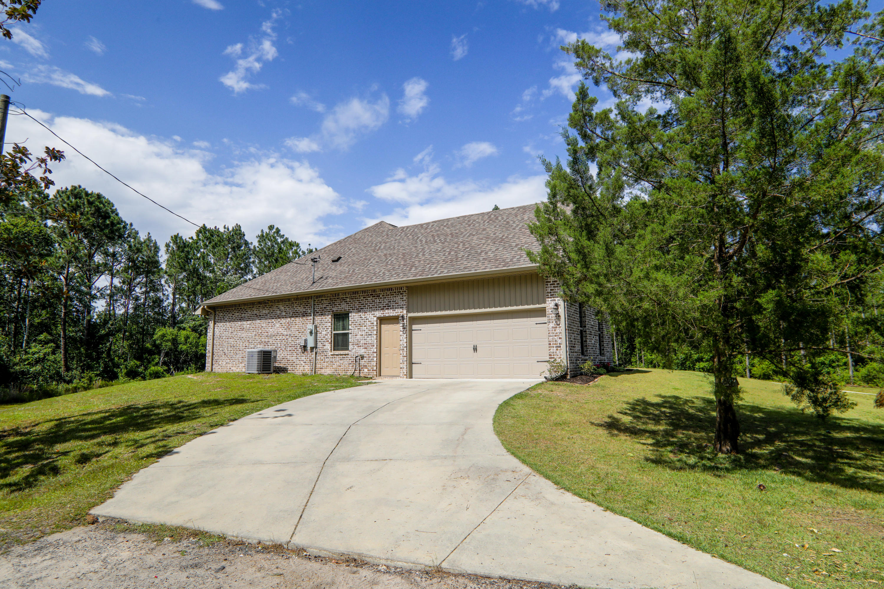 3037 Robinson Point Road Milton, FL 32583 - Photo 18 of 22 a view of a house with a yard